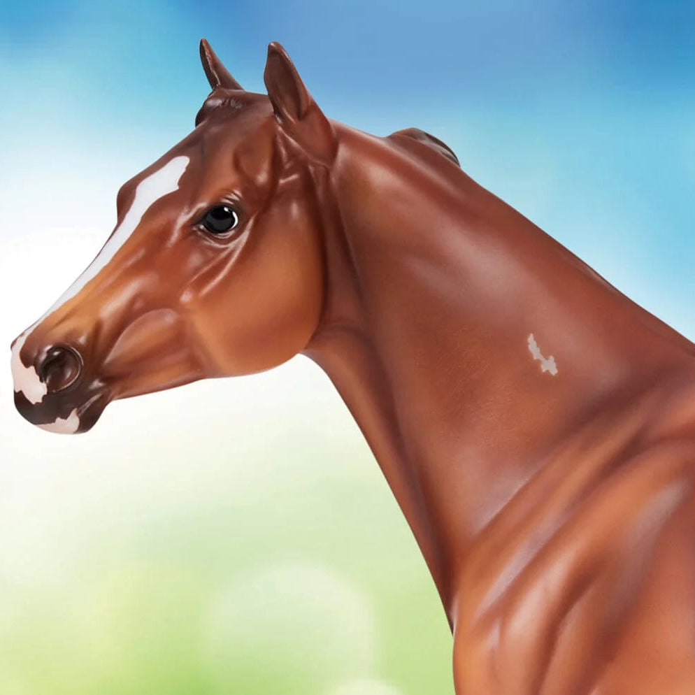 Brown horse figurine against a blue and green gradient background